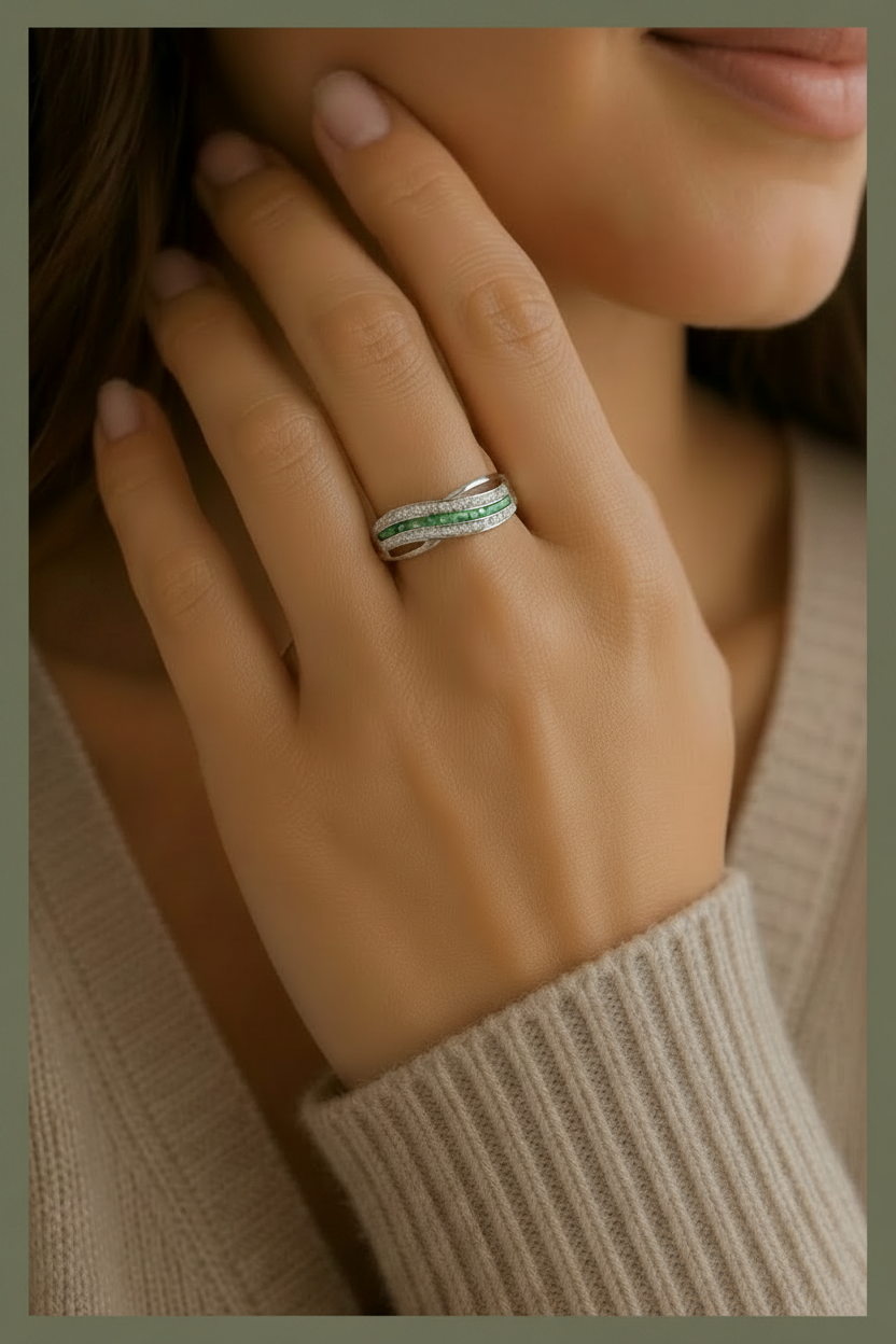 Silver memorial ashes ring with a light green coloured ash inclusion in a wave design, handcrafted memorial jewellery uk. 